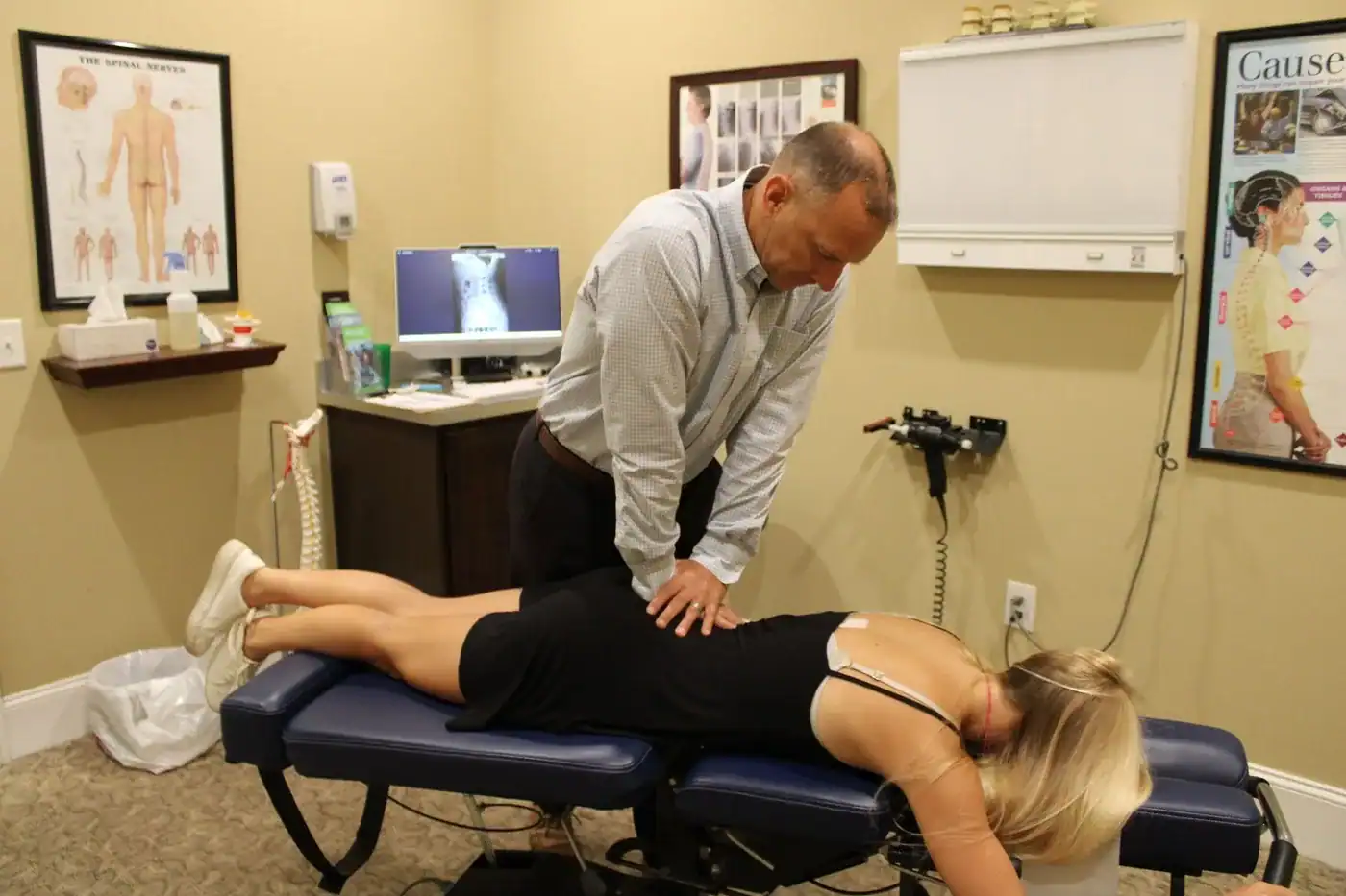 Dr. Neil Fico performing a chiropractic adjustment in Pawleys Island SC